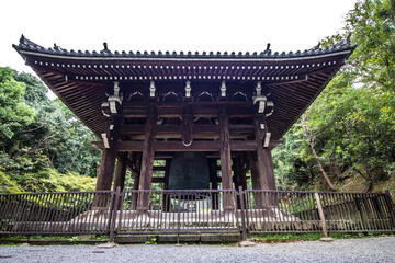 Obraz premium Perfect framing Close-up view from below an ancient Japanese temple in Kyoto, Japan, mature tree and zen garden, horizontal image