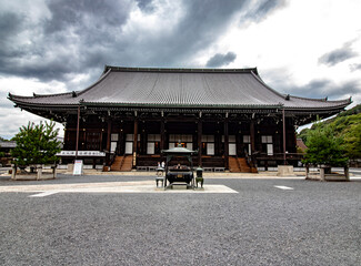 Horizontal image of a temple in the Asakusa district, Tokyo, Japan, cloudy sky and zen garden. Ancient temple and cultural experience. 
