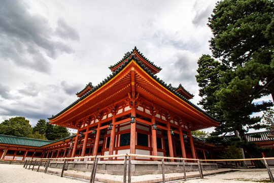 Fisheye effect photo of a red ancient and famous temple in Kyoto, Japan. Horizontal image of historical sites, spiritual retreat and zen garden.