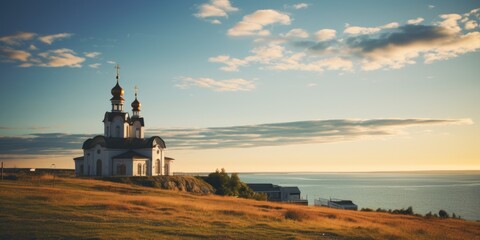 A picturesque church perched atop a hill overlooking the ocean. Perfect for scenic landscapes or religious themes