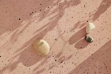 Summer background with natural pebbles under shadows. Sustainable, zero waste, no air atmosphere...