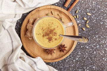 Natural masala tea. Traditional Indian hot drink with milk and spices close up