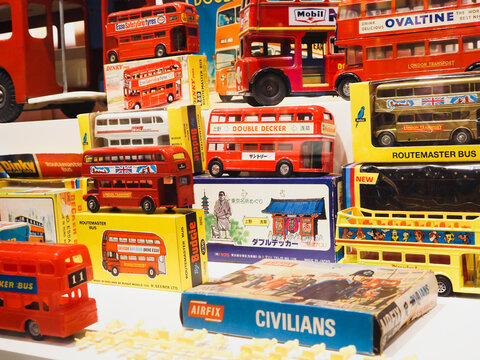 TOKYO, JAPAN - August 26, 2023: Display of vintage British toy buses including ones made by Budgie and Dinky.