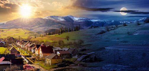 carpathian rural landscape in springtime. ukrainian village in the valley. arable on the alpine...