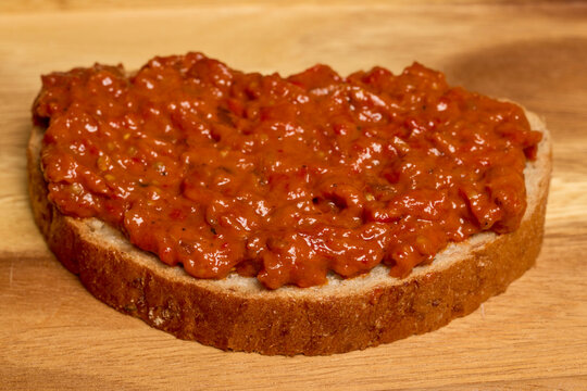 Zacusca, food made from eggplant on a slice of bread.