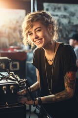A woman with tattoos sitting at a typewriter. This image can be used to depict creativity, writing, and self-expression