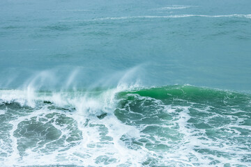 Wave splashing close-up. Crystal clear sea water, in the ocean in San Francisco Bay, blue water, pastel colors.