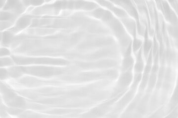 Obraz premium White water with ripples on the surface. Defocus blurred transparent white colored clear calm water surface texture with splashes and bubbles. Water waves with shining pattern texture background.