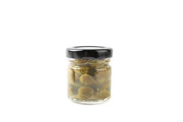 Capers in a glass jar isolated on a white background. Marinated caper buds, small salted capparis in bowl, fermented food, pickled capers group.Organic spices and seasonings.