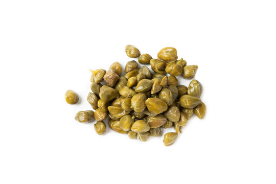 Capers isolated on white background. Marinated caper buds, small salted capparis in bowl, fermented food, pickled capers group.Organic spices and seasonings.