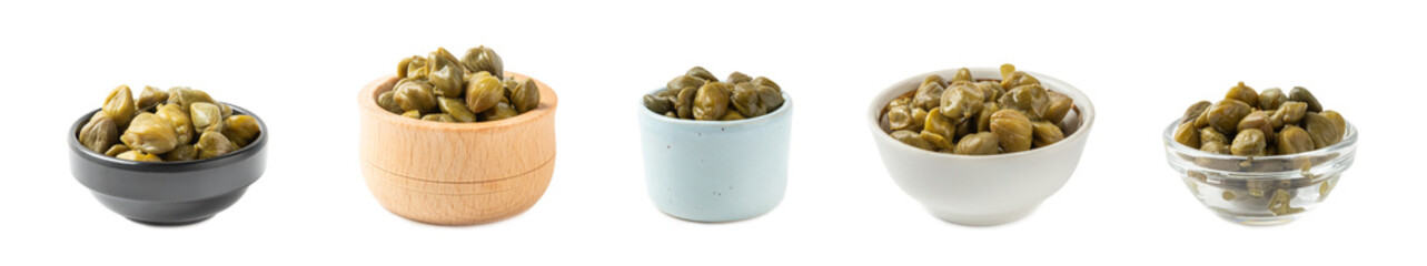 Capers in a bowl isolated on a white background. Marinated caper buds, small salted capparis in bowl, fermented food, pickled capers group.Organic spices and seasonings.