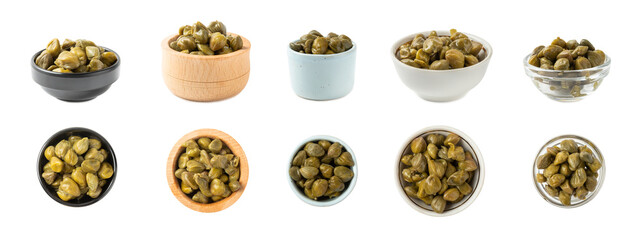Capers in a bowl isolated on a white background. Marinated caper buds, small salted capparis in bowl, fermented food, pickled capers group.Organic spices and seasonings.