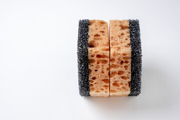 Two new foam sponges with a black abrasive layer for cleaning dishes and removing dirt
