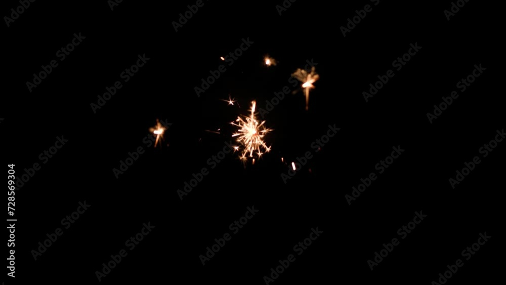 Poster Fireworks bengal Flicker on a dark background. Easy to add lens flare effects for overlay designs or screen blending mode to make high-quality images.