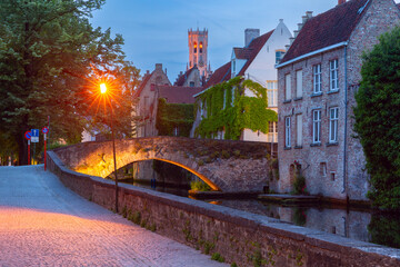 Scenic night cityscape with a medieval tower Belfort and the Green canal, Groenerei, in Bruges,...