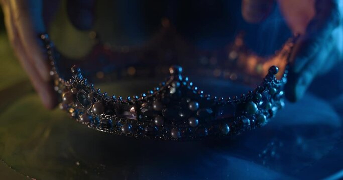 Fabulous golden crown of the king on a dark background. Panoramic view of the fog. Mockup for your logo.