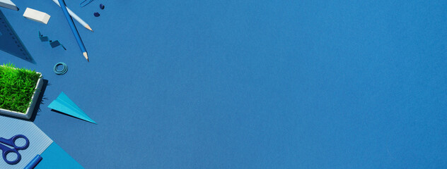 School supplies on a blue background. Top view.  - obrazy, fototapety, plakaty