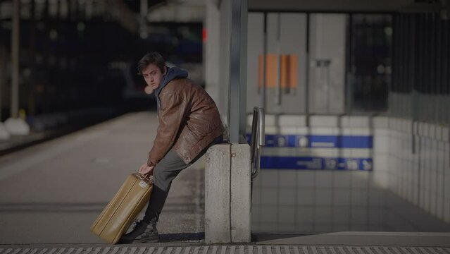 Mother Waiting for Son at Train Station Checking the Time to Consult a Watch