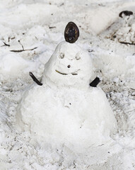 Sandman, doll from sand, snowman by the beach