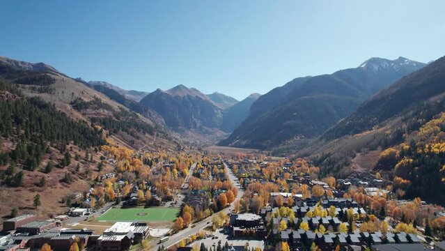 Drone shot panning down over Telluride, CO and Black Bear Pass