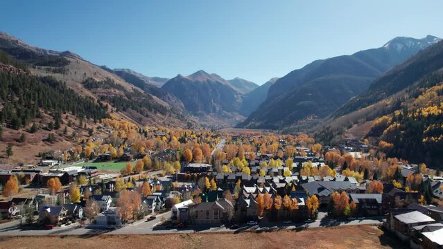 Slow and cinematic drone shot flying across downtown Telluride, CO in the fall