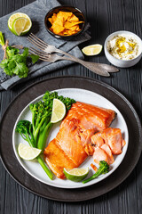 hot smoked salmon with cooked broccoli and lime