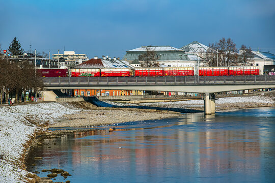 Salzburg, Austria - 01.13.2024: Railway bridge overpass over the river Salzach.