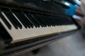 Fototapeta na wymiar dusty old piano keyboard