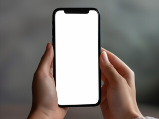 Mockup close-up of a person's hands holding a smartphone with a white blank screen