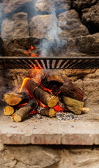 Firewood burning on barbecue for grilling