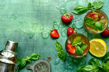 Fresh ingredients and props for making summer cold cocktail strawberry mojito. Top view with copy space. - obrazy, fototapety, plakaty