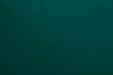 Dark Turquoise Paper with a Delicate Embossed Surface. Dark Green Clear Decorative Cardboard. Paper Texture. No text. Textured Rough Paper Layout. Elegant Paper Sheet with Soft Canvas Structure.