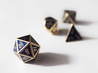 blue and gold dnd dice isolated on white and copy space to add text
