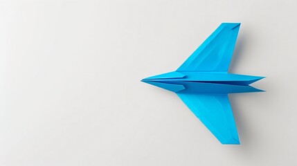 Blue paper plane against a white background