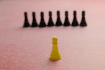 Leadership concept Chess pawn stands out from the crowd. Selective focus