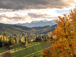 view of the mountains from another mountain in autumn	