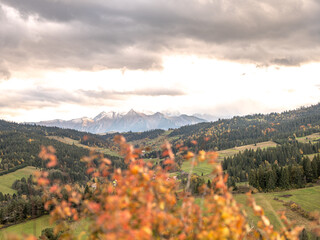 view of the mountains from another mountain in autumn	