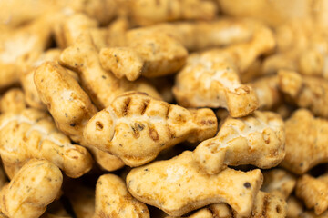 A treat for cats and kittens is a fish-shaped catnip cookie close-up.
