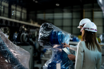 Business engineers meet and check control heavy machine robot arm. Diverse Team of Industrial...
