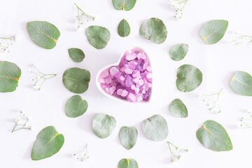Spa and wellness concept. Aromatic Himalaya salt and essential massage oil on white background with...