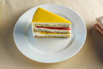 Indulge in the delectable sight of a scrumptious slice of cake gracefully placed on a pristine...
