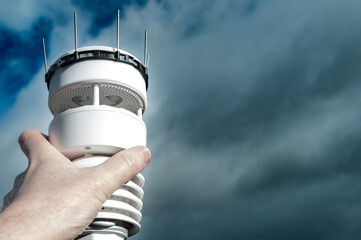 Meteorologist seen installing an advanced weather station which uses ultrasonic to measure wind...