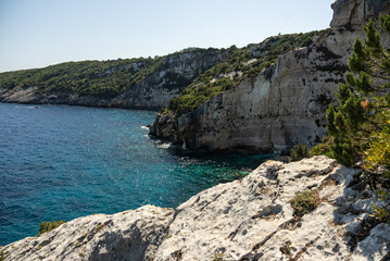 Obraz premium Blue caves in zakynthos, Greece. Potamitis Dive Spot, Zakynthos, greece. Skinari View Point. Blue Caves located between Aghios Nikolas and Cape Skinnari. Turquoise ionian sea in greek island.