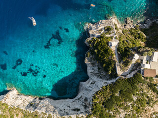 Blue caves in zakynthos, Greece. Potamitis Dive Spot, Zakynthos, greece. Skinari View Point. Blue Caves located near Cape Skinnari. Aerial drone view Turquoise ionian sea in greek island.