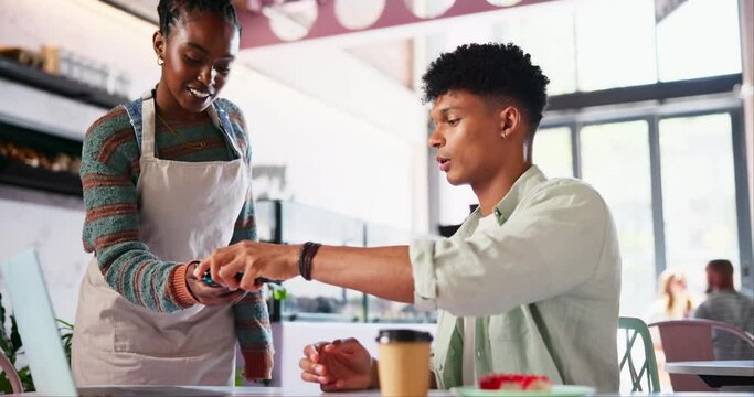 Coffee shop, man and waitress with pos, phone and easy payment with barista for check, help or service. Woman, people and smartphone with fintech app for paperless transaction in cafeteria with smile
