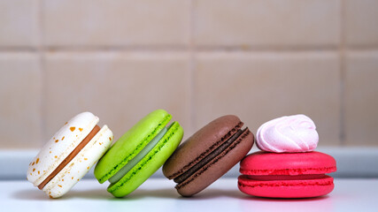 colorful dessert macaroon with a drop of meringue