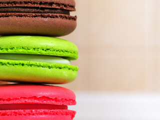 Macaron cake or macaroons on kitchen background, colorful dessert