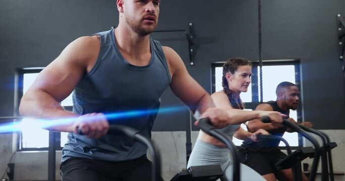 Fitness, spin class and people in gym for training, intense workout and exercise for health club. Sports, cardio machine and men and women on cycling equipment for performance, endurance and wellness