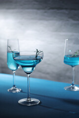 Glasses with blue alcohol cocktail ready for a party