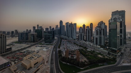 Fototapeta na wymiar Panorama of Bay Avenue with modern towers residential development in Business Bay aerial all day timelapse